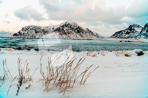 Image of Norway coast in winter with snow bad cloudy weather