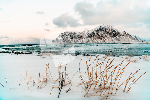 Image of Norway coast in winter with snow bad cloudy weather