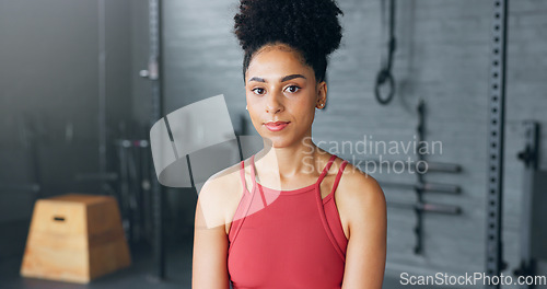 Image of Exercise, motivation and portrait of black woman at the gym ready for workout. Smile, happy and female personal trainer in gymnasium for inspiration in sports, fitness and training for body wellness