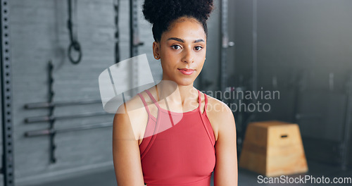 Image of Exercise, motivation and portrait of black woman at the gym ready for workout. Smile, happy and female personal trainer in gymnasium for inspiration in sports, fitness and training for body wellness