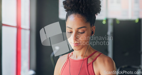 Image of Black woman, breathe and earphones for music with fitness and exercise ready in gym, health and active motivation. Start, workout and calm for body training and endurance, wellness and listening.