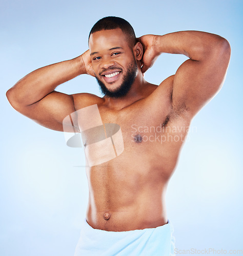 Image of Portrait, body care and man in studio for cleaning, grooming or hygiene against blue background. Face, shower and male wellness model relax for beauty, routine and self care while posing isolated