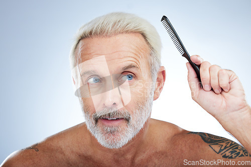 Image of Hair style, comb and grooming with man in studio for haircare, barber and morning routine. Beauty, hairdresser and salon with senior male on white background for handsome, self care and brushing