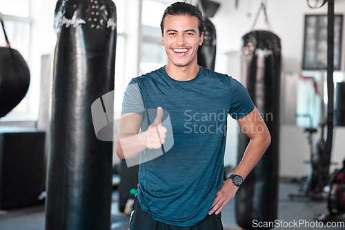 Image of Laughing, thumbs up and portrait of man in gym for success, motivation or workout. Comic, hand gesture or happy male athlete with emoji for yes, like or approval, agreement or fitness, goal or target