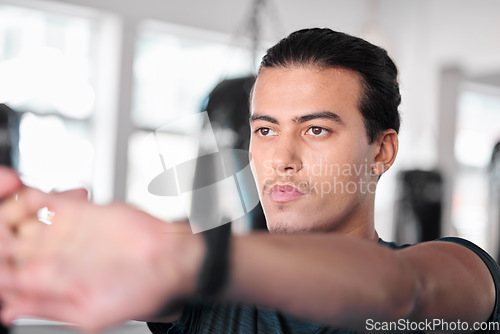 Image of Hands, stretching fingers and man in gym ready to start workout, training or exercise. Sports fitness, thinking and serious male athlete warm up, stretch or prepare for exercising for flexibility.