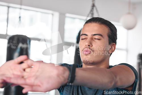 Image of Hands, stretching fingers and man in gym ready to start workout, training or exercise. Sports fitness, health and serious male athlete warm up, stretch or prepare for exercising for flexibility.