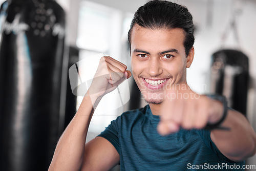 Image of Portrait, boxer punch and smile of man in gym ready to start workout, training or exercise. Boxing sports, wellness face and happy male athlete throw fist for fight, exercising or mma for strength.