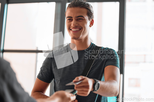 Image of Credit card, man smile and payment at gym for fitness membership or exercise subscription. Fintech pos, ecommerce and happy athlete buying or paying for workout or training bill at exercising club.