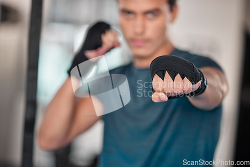 Image of Man, hands and fists for boxing fitness, fight or strength training exercise, workout or martial arts at gym. Fist of male boxer or fighter ready for fighting challenge, practice or punching indoors