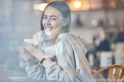 Image of Happy, cafe and portrait of a woman with a coffee, enjoying a drink and warm beverage. Smile, relax and a girl drinking a cappuccino, tea or latte at a restaurant in the morning for happiness