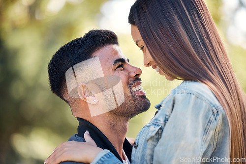 Image of Face, love and a couple in the garden together, feeling happy while dating for romance in summer. Smile, park or spring with a man and woman bonding outside in nature as a romantic partnership