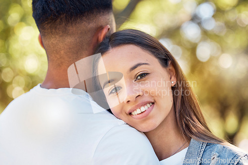 Image of Love, hug and shoulder with couple in park for bonding, affectionate and free time. Happiness, date and smile with portrait of woman hugging man in nature for relax, summer and romance on vacation