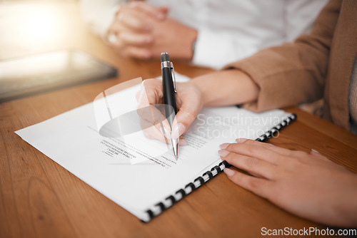 Image of Business people, hands and signing contract for hiring, interview or legal document in recruitment on desk. Hand of woman writing paperwork or filling form for hire, recruiting process or signature