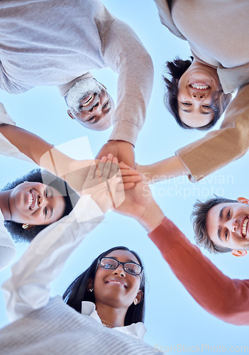 Image of Low angle, hands or happy people portrait in meeting for innovation, success or project development. Collaboration huddle, teamwork or group of men or women with goals, strategy plan or mission