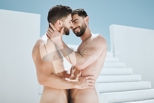 Image of Art, nudity and smile, gay couple embrace and kiss in sun with Greek architecture, photography and lgbt love. Creative aesthetic, artistic passion and pride, naked men with athletic body and blue sky