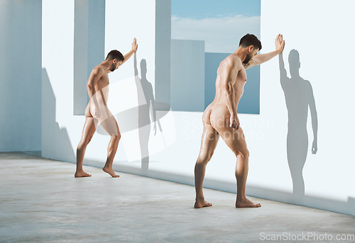 Image of Art, photography and naked men from the back, sun and shadow leaning on wall in creative architecture. Pride, power and lgbt body, gay couple in athletic Greek statue pose, freedom in self expression