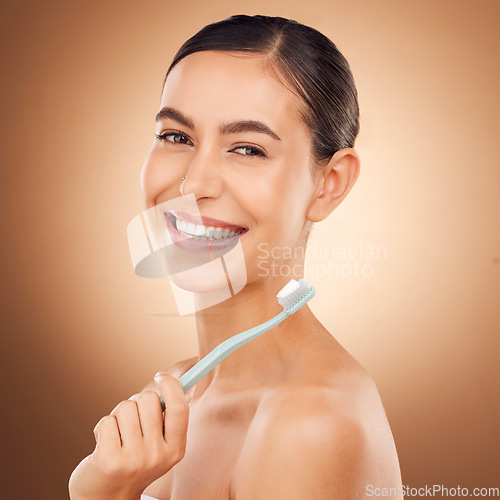 Image of Woman, toothbrush and smile in studio portrait for wellness, self care and beauty by gradient background. Happy healthcare model, dental health and toothpaste for mouth hygiene, cleaning and teeth