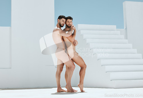 Image of Art, romantic embrace and naked men pose together in sun, blue sky and Greek architecture in lgbt photography. Creative pride aesthetic, artistic passion and love, nude gay couple with athletic body.