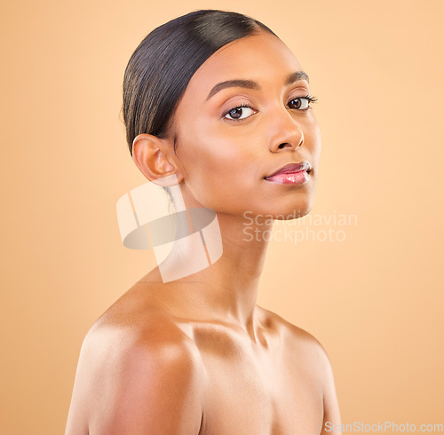 Image of Beauty portrait, face and a woman in studio for skincare, cosmetics, dermatology or makeup. Aesthetic female for self care, natural skin and spa facial shine or wellness results on a brown background