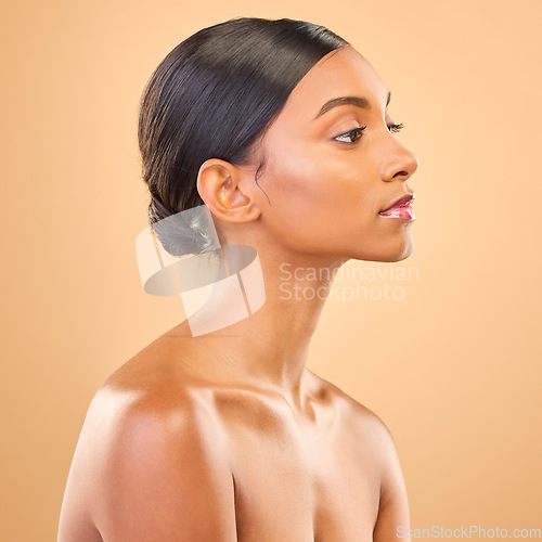 Image of Beauty, face and profile of woman in studio for skincare, cosmetics, dermatology or makeup. Aesthetic female .serious about self care, natural skin and spa facial shine results on a brown background