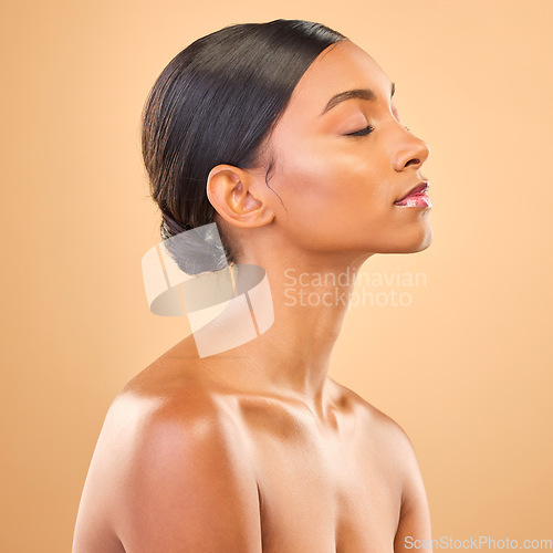 Image of Beauty, profile and face of woman in studio for skincare, cosmetics, dermatology or makeup. Aesthetic female .with eyes closed for self care, natural skin and calm facial or shine on brown background