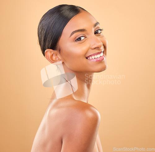 Image of Face, beauty and smile portrait of woman in studio for skincare, cosmetics, dermatology or makeup. Aesthetic female happy for self care, natural skin or spa facial shine results on a brown background