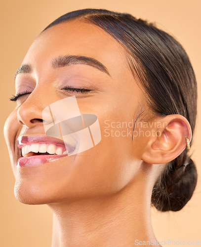 Image of Beauty face, skin and smile of woman in studio for skincare, cosmetics, dermatology or makeup. Aesthetic female .headshot for self care, natural skin and spa facial shine results on brown background