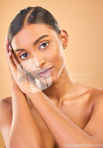 Image of Face portrait, skincare and beauty of woman in studio isolated on a brown background. Makeup, natural cosmetics and serious Indian female model with spa facial treatment for healthy or flawless skin.