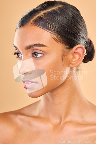 Image of Skincare, face and beauty of woman in studio for glow, cosmetics, dermatology or makeup. Aesthetic female .profile for self care, natural skin and spa facial shine results on a brown background