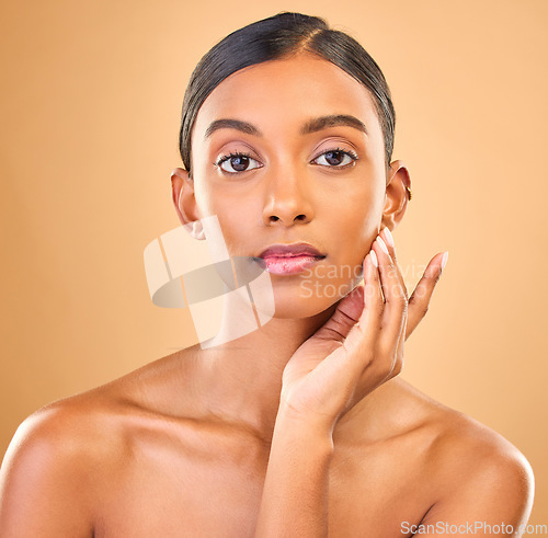 Image of Skincare, face portrait and beauty of woman in studio isolated on brown background. Natural makeup, cosmetics and confident Indian female model with spa facial treatment for healthy or flawless skin.