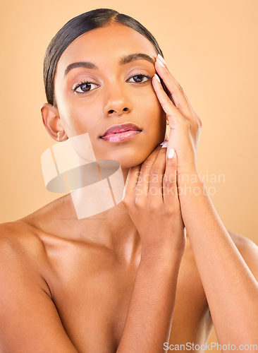 Image of Skincare, face portrait and beauty of woman in studio isolated on a brown background. Makeup, cosmetics and confident Indian female model with spa facial treatment for healthy, glow or flawless skin.