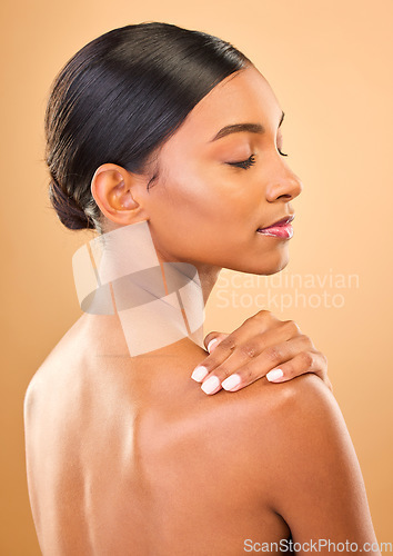 Image of Beauty, face and skin of woman in studio for skincare, cosmetic, dermatology or makeup. Aesthetic female .profile and hand for self care, natural glow and facial shine or bodycare on brown background