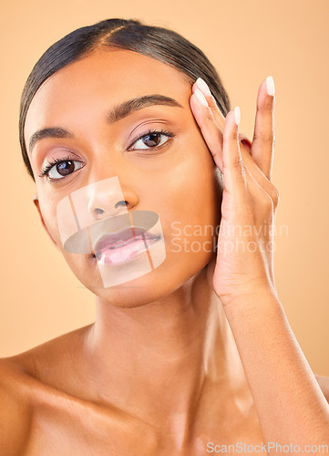 Image of Skincare, face portrait and beauty of woman in studio isolated on brown background. Natural makeup, cosmetics and confident Indian female model with spa facial treatment for healthy or flawless skin.