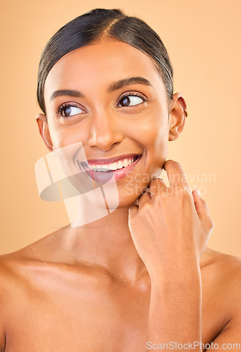 Image of Beauty, skin care and smile of woman in studio for glow, cosmetics, dermatology or makeup. Aesthetic female .thinking about self love, natural face and spa facial shine results on a brown background