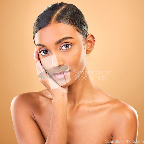 Image of Skincare, face portrait and beauty of woman in studio isolated on brown background. Makeup, cosmetics and confident Indian female model with spa facial treatment for healthy, glowing or flawless skin