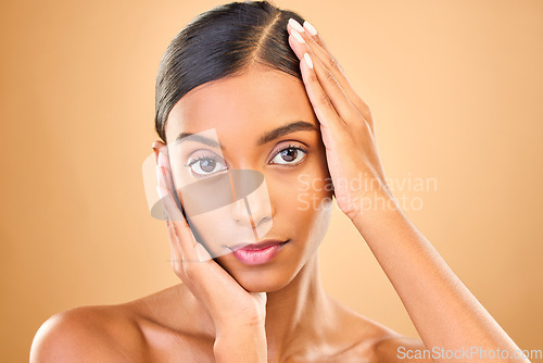 Image of Skincare, face portrait and beauty of woman in studio isolated on brown background. Natural makeup, cosmetics and confident Indian female model with spa facial treatment for healthy or flawless skin.