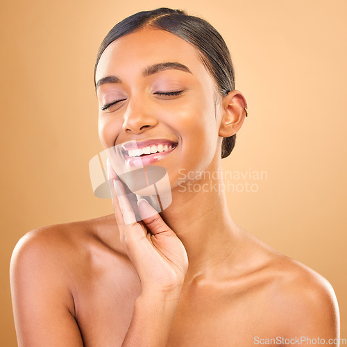 Image of Indian woman, face and beauty with smile, skincare with natural cosmetics glow on studio background. Happy female, eyes closed and cosmetic care, dermatology and facial treatment wellness and makeup