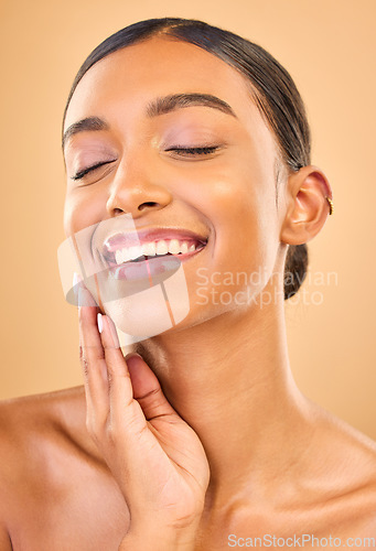 Image of Makeup, beauty and face or smile of woman in studio for skincare, cosmetics and dermatology. Aesthetic female .hand for self care, natural skin and spa facial shine results on a brown background