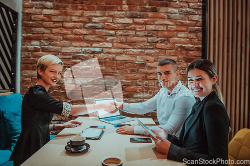 Image of Business shaking hands, finishing up meeting. Successful businesspeople handshaking after good deal