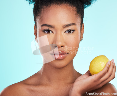 Image of Lemon, skincare and portrait of serious black woman in studio for wellness, natural cosmetics and facial. Dermatology spa, beauty and face of girl with citrus fruit for detox, vitamin c and nutrition