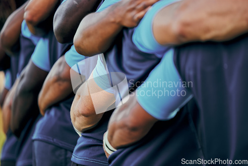 Image of Rugby, sports and team of athletes embracing and standing together for support, unity and teamwork in a match or game. Arms, collaboration and group of players on a sports field hugging