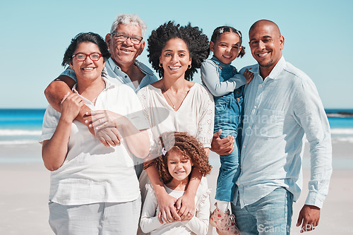 Image of Smile, big family and portrait at beach on vacation, bonding and care at seashore. Holiday relax, summer ocean and happy father, mother and children, girl or grandparents enjoying time together.