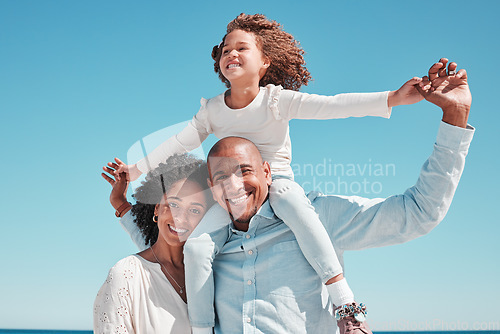 Image of Family, smile and piggyback portrait on blue sky at beach on vacation, bonding and care at seashore. Holiday relax, summer and happy father, mother and kid or girl enjoying playing together outdoors.