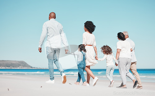 Image of Family, grandparents and children walking on beach to relax on summer holiday, vacation and weekend. Happy, parents and back of mother, dad and kids holding hands for calm, bonding and quality time