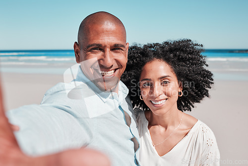 Image of Couple, smile and selfie portrait at beach on vacation, bonding and care at seashore. Holiday love, summer ocean and man and woman taking pictures for social media, profile picture or happy memory.