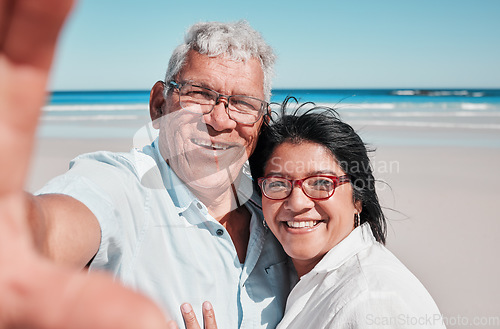 Image of Portrait, selfie and elderly couple at a beach for travel, vacation and bonding against ocean background. Face, love and seniors enjoying retirement, holiday and sea trip, photo and profile picture