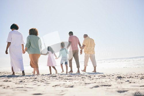 Image of Family, walking on beach sand and holding hands, generations and people, grandparents with parents and kids. Together outdoor, unity and trust, travel to Bali with love, care and bond with back view