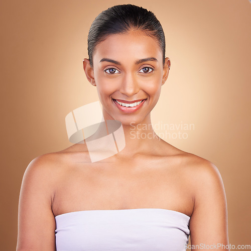 Image of Skincare, beauty and portrait of Indian woman with smile for wellness, natural skin and facial treatment in studio. Dermatology, luxury spa and face of happy girl with makeup, cosmetics and confident