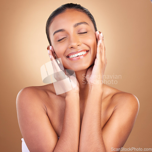 Image of Beauty, skincare and face with indian woman in studio for happy, spa treatment and facial. Cosmetics, self care and glow with model on brown background for satisfaction, natural makeup and confidence