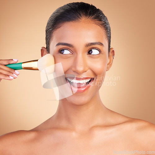 Image of Makeup brush, smile and woman with natural beauty, wellness and happiness from cosmetics. Facial skin glow, happy and cosmetic, artist and face tool of a young female model with self care in a studio